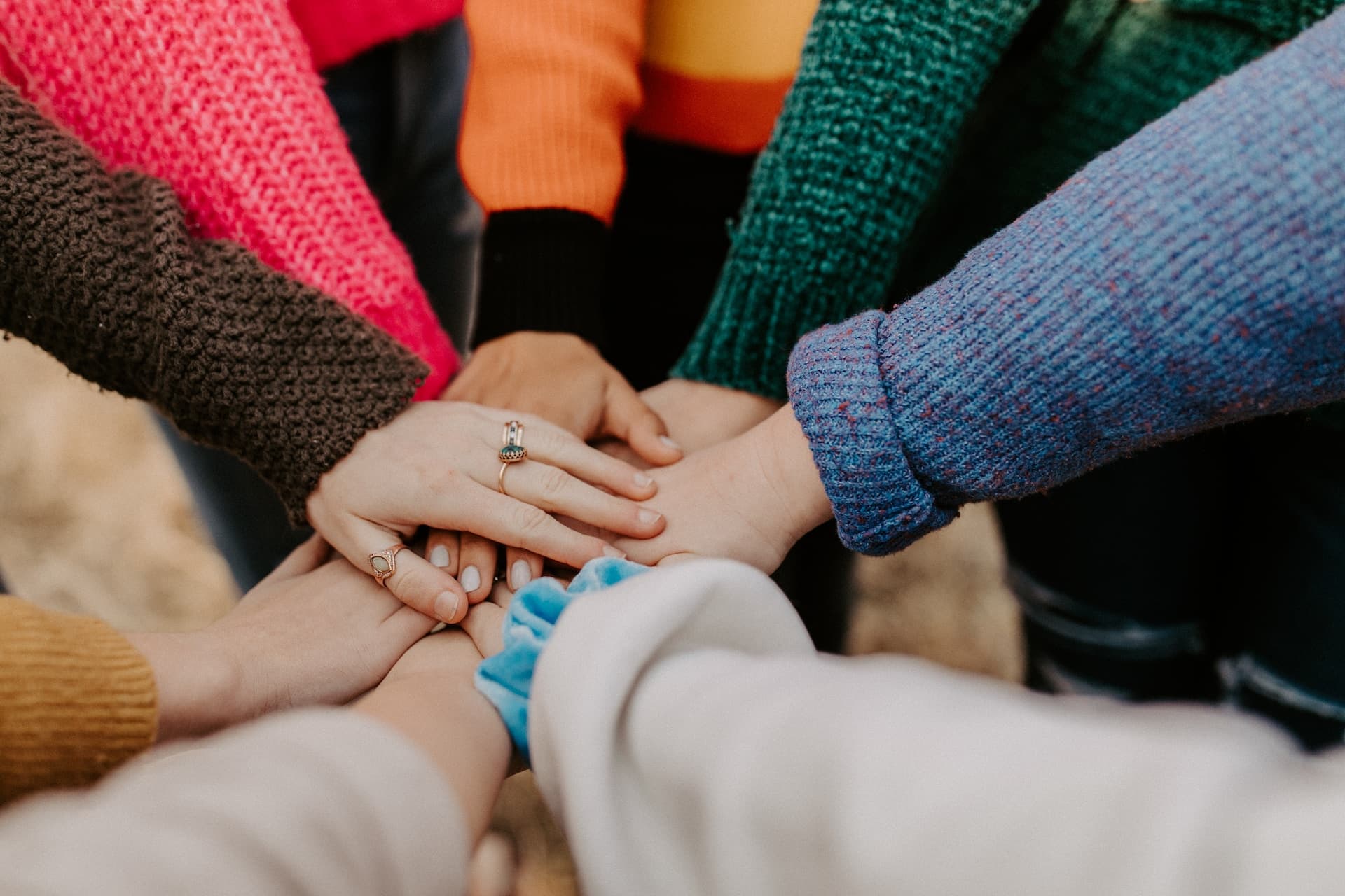 Hands overlapping in a group